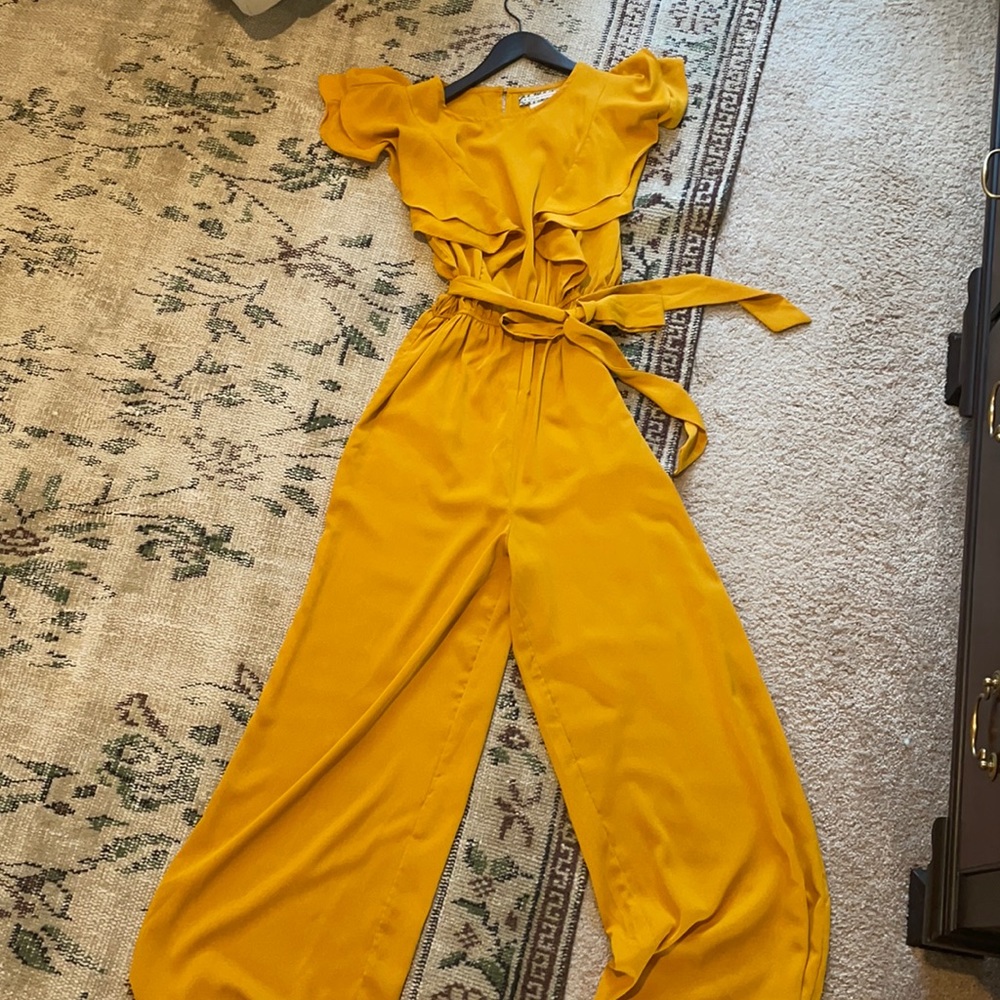 Super cute jumpsuit! Has pockets! Only worn once.